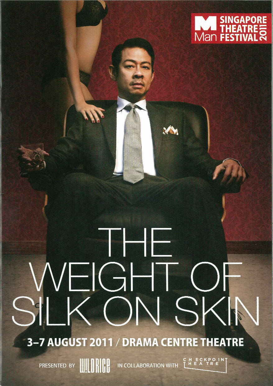 The programme of features Ivan Heng dressed in a suit, seated with a tumbler of whiskey in his hand. A faceless lady dressed in lingerie lingers behind him, with a manicured hand resting on his shoulder. 