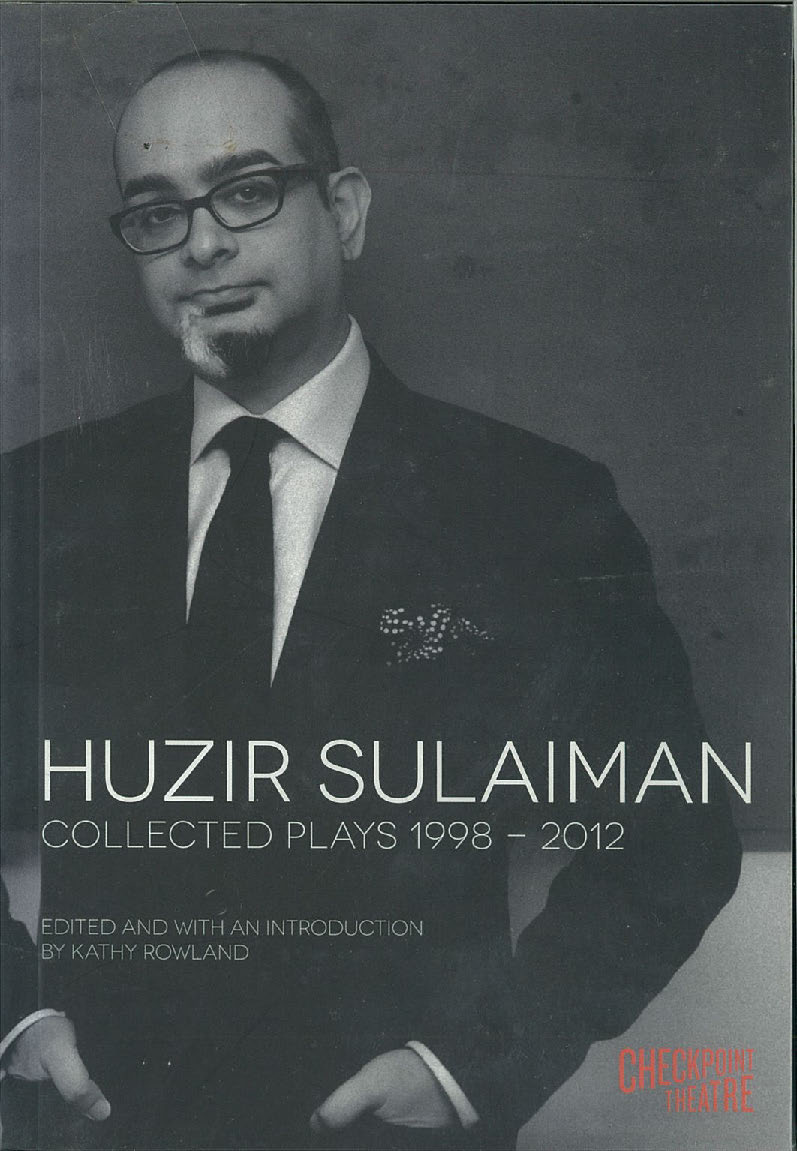 The publication features a black and white image of Huzir Sulaiman wearing a suit and tie, hands in his pockets, smiling slightly.