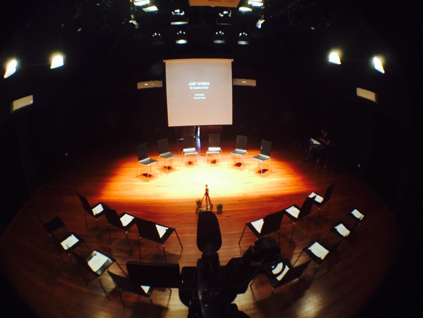 An aerial view of the 42 Waterloo Street Black Box, with six chairs arranged in front of a screen, and 14 more facing those.