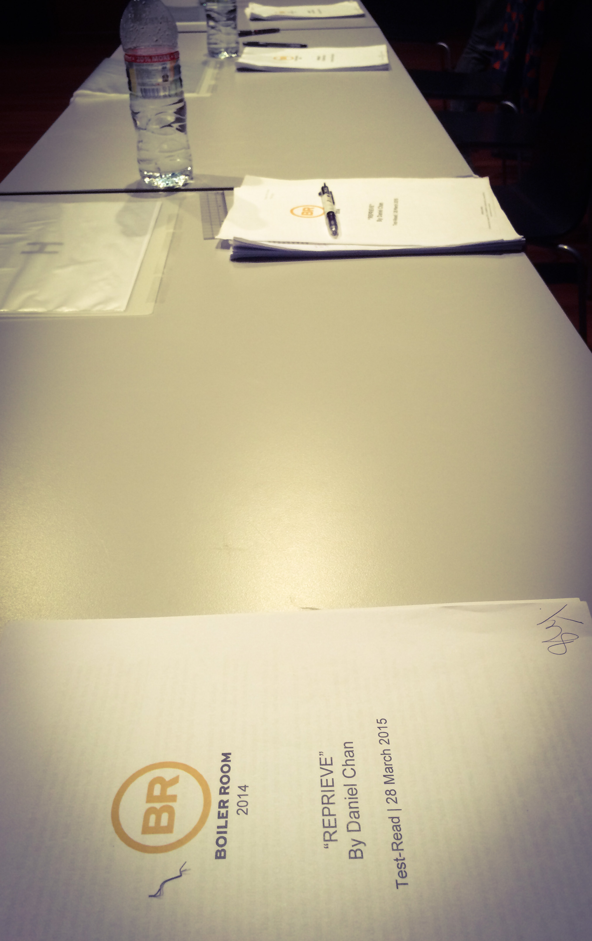 A few sets of scripts lying across two tables.