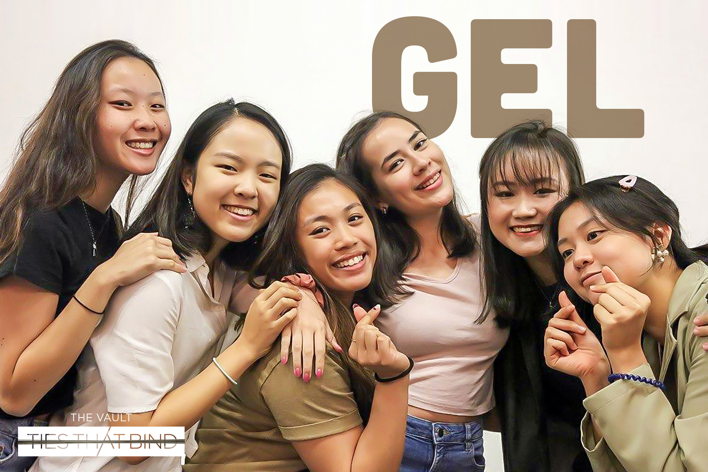 The photograph features a group of six girls posing for the camera.