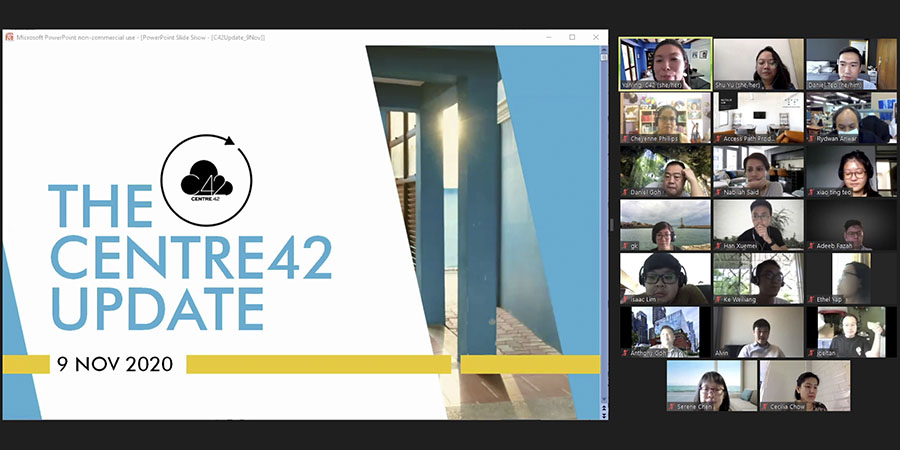 A Zoom session with several participants, with the screen-share displaying an image of 42 Waterloo Street overlayed with the words 'The Centre 42 Update' in light blue font against a white rhombus.