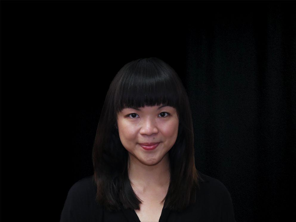 Photograph of a woman in bangs, and dressed in a black shirt.