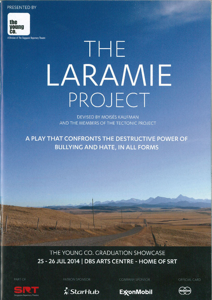 The programme cover features a scene of a desert with a large blue sky and mountains silhouettes afar. The production title overlays in white text.