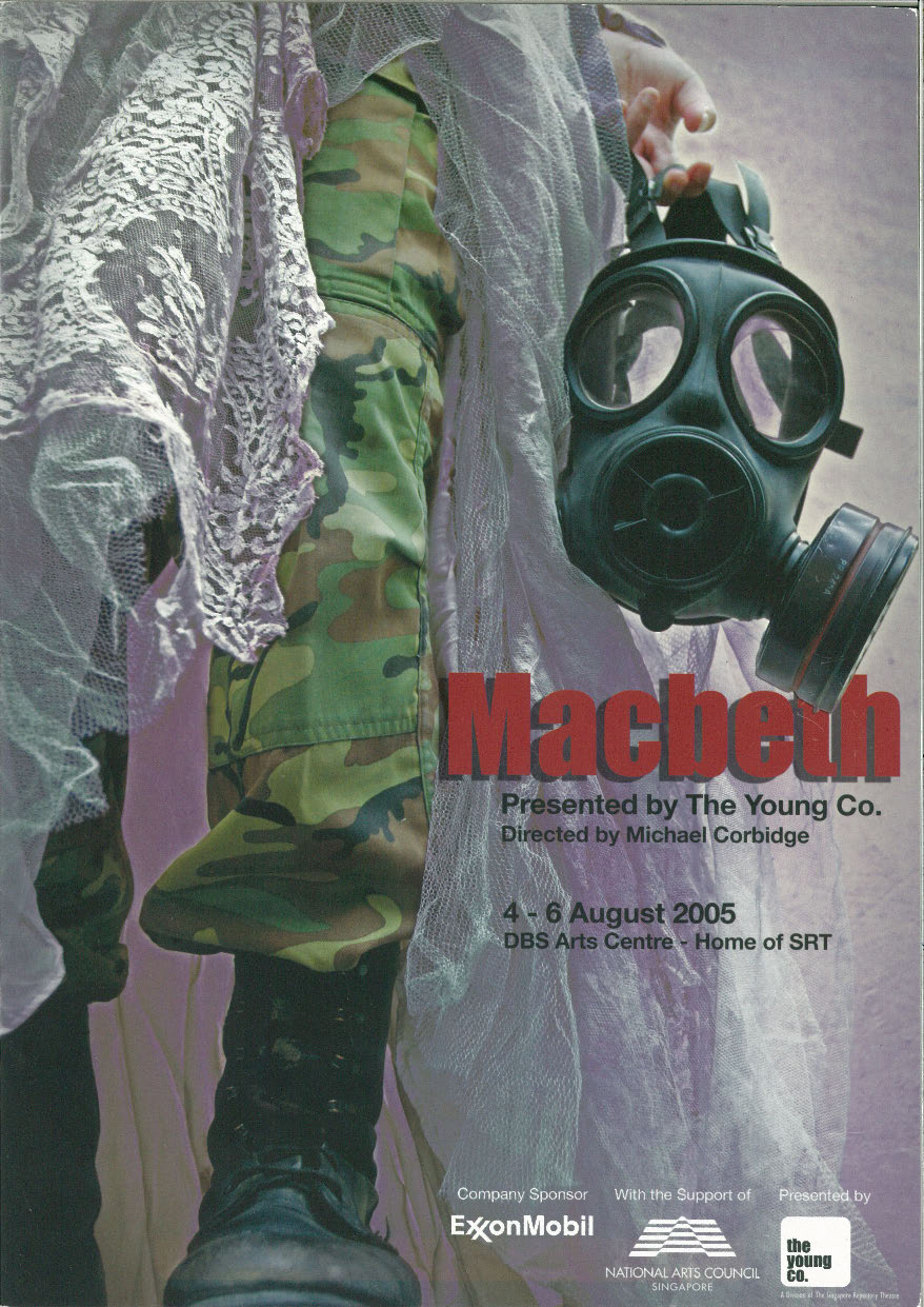 The programme cover depicts a hazmat mask held by an individual in army print green and yellow pants and black boots. The production title appears in red text.