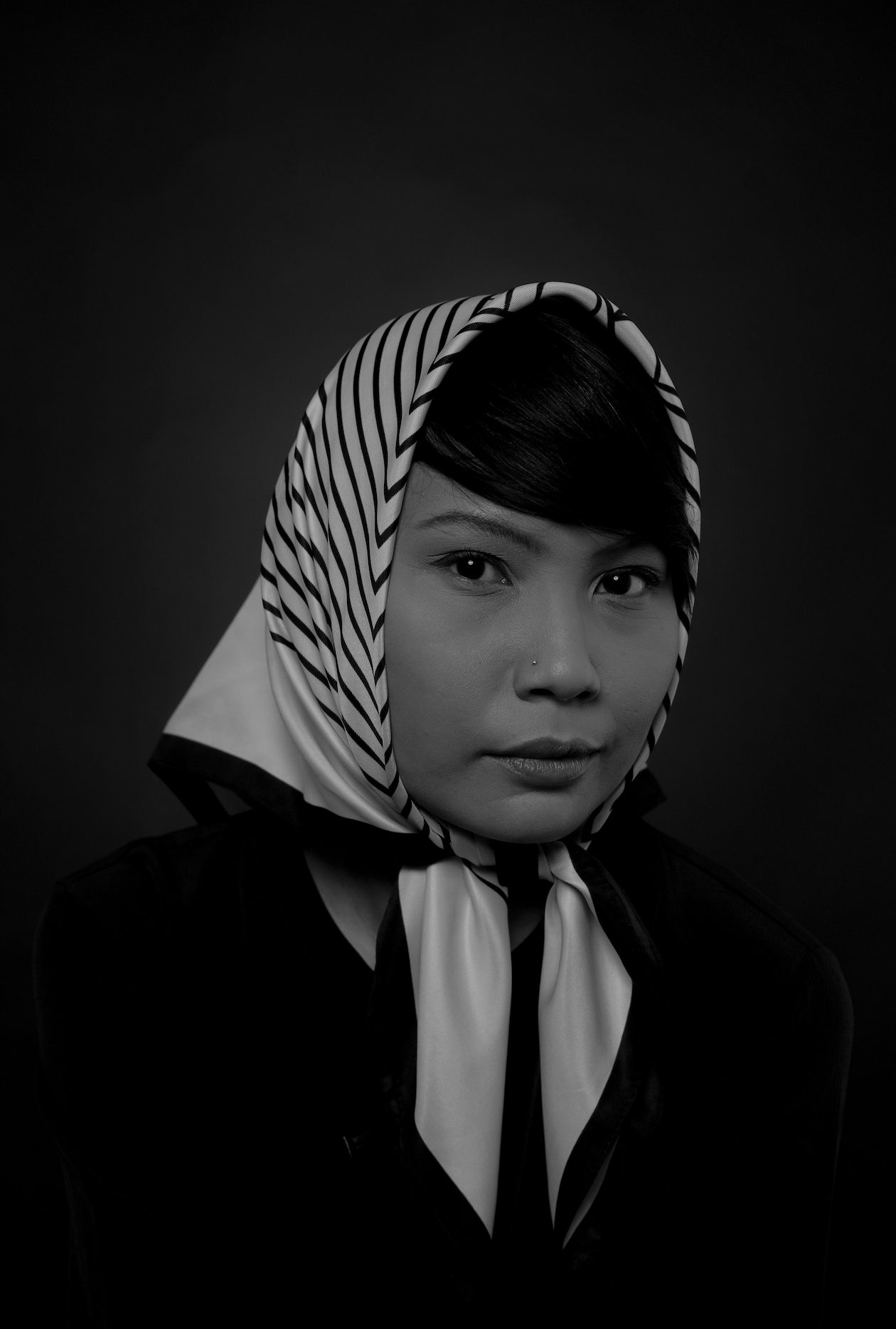 A greyscale image of Nessa Anwar.