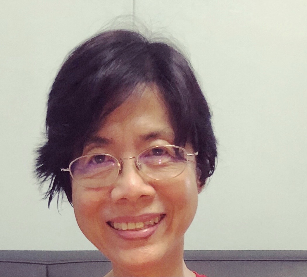 An image of Poey Huang with short black hair and bespectacled.