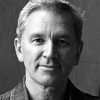 Black and white headshot of David Pledger.