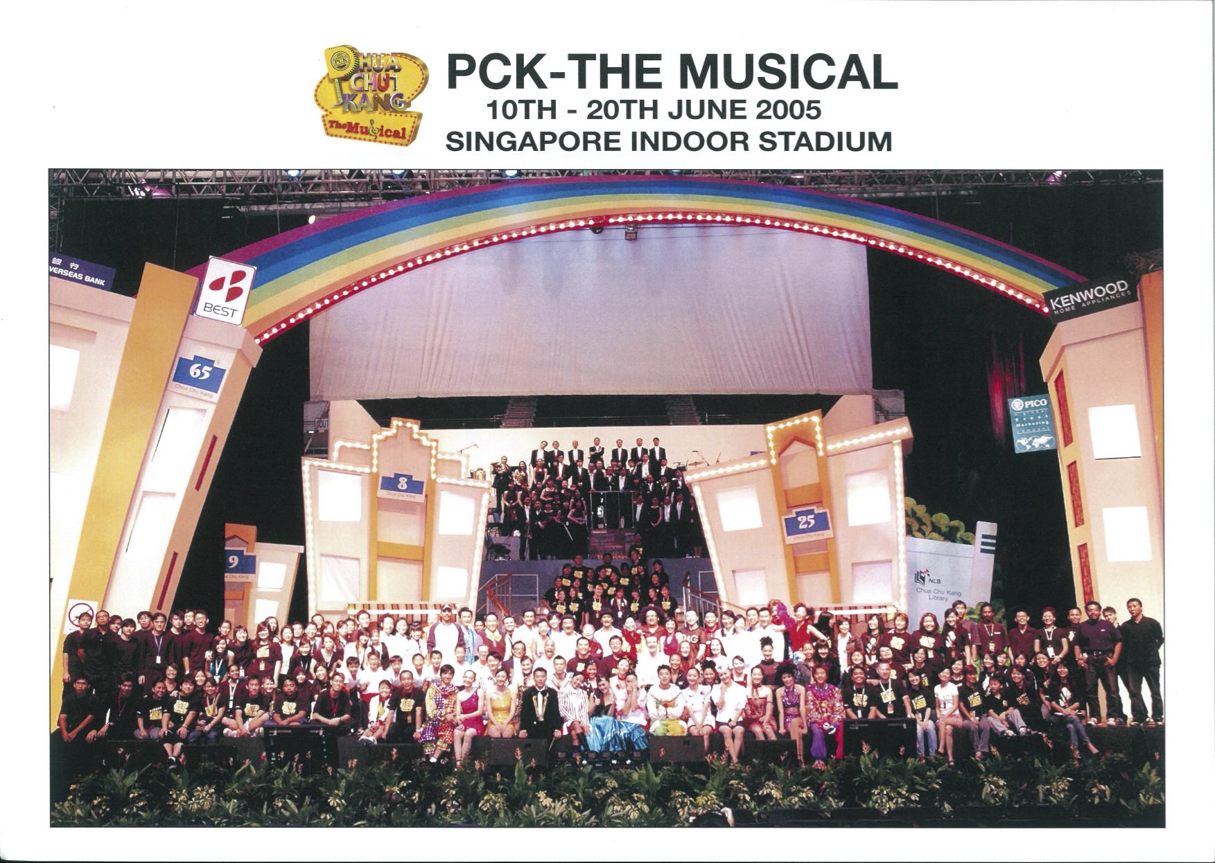 The poster features an image of the cast and crew of 'PCK The Musical' on the stage at Singapore Indoor Stadium.