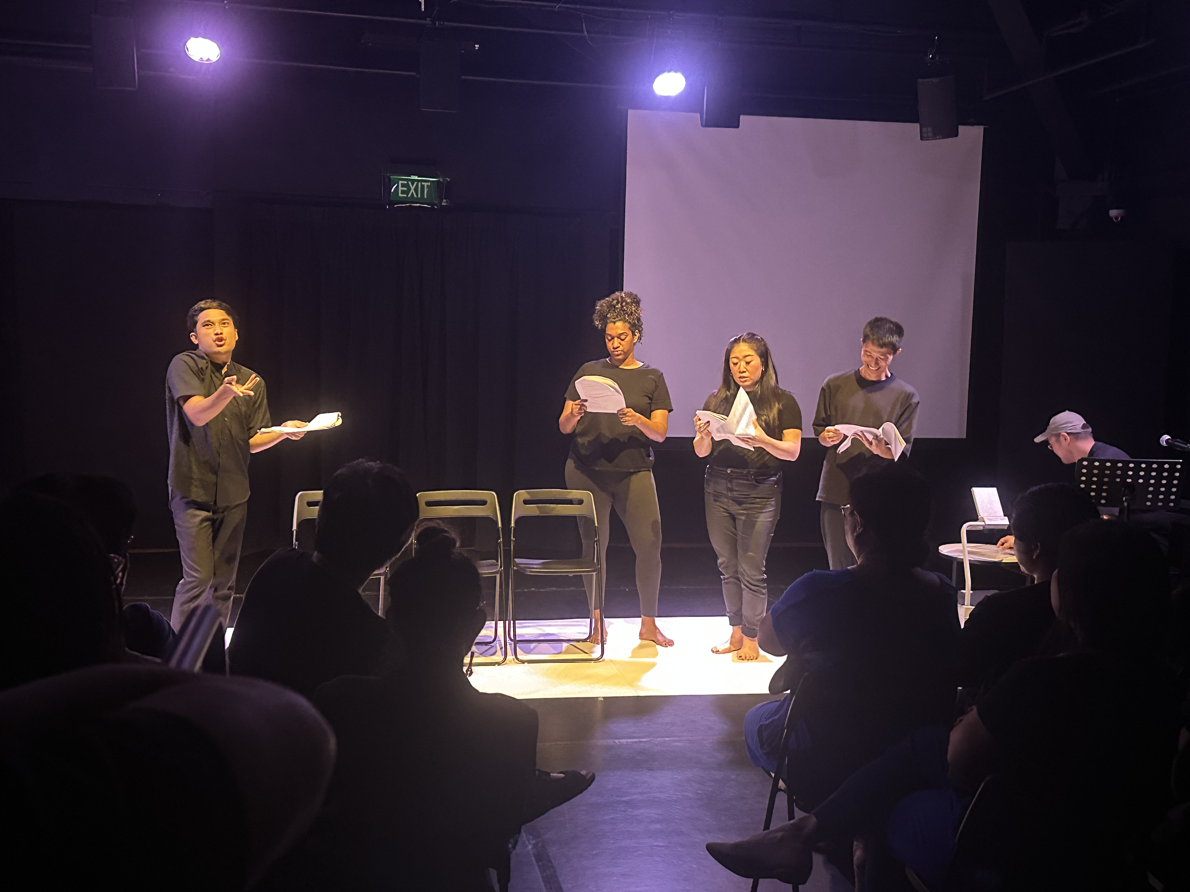 A photograph of the Studio A dramatised reading, featuring the cast of Asymptote by Danial Matin.