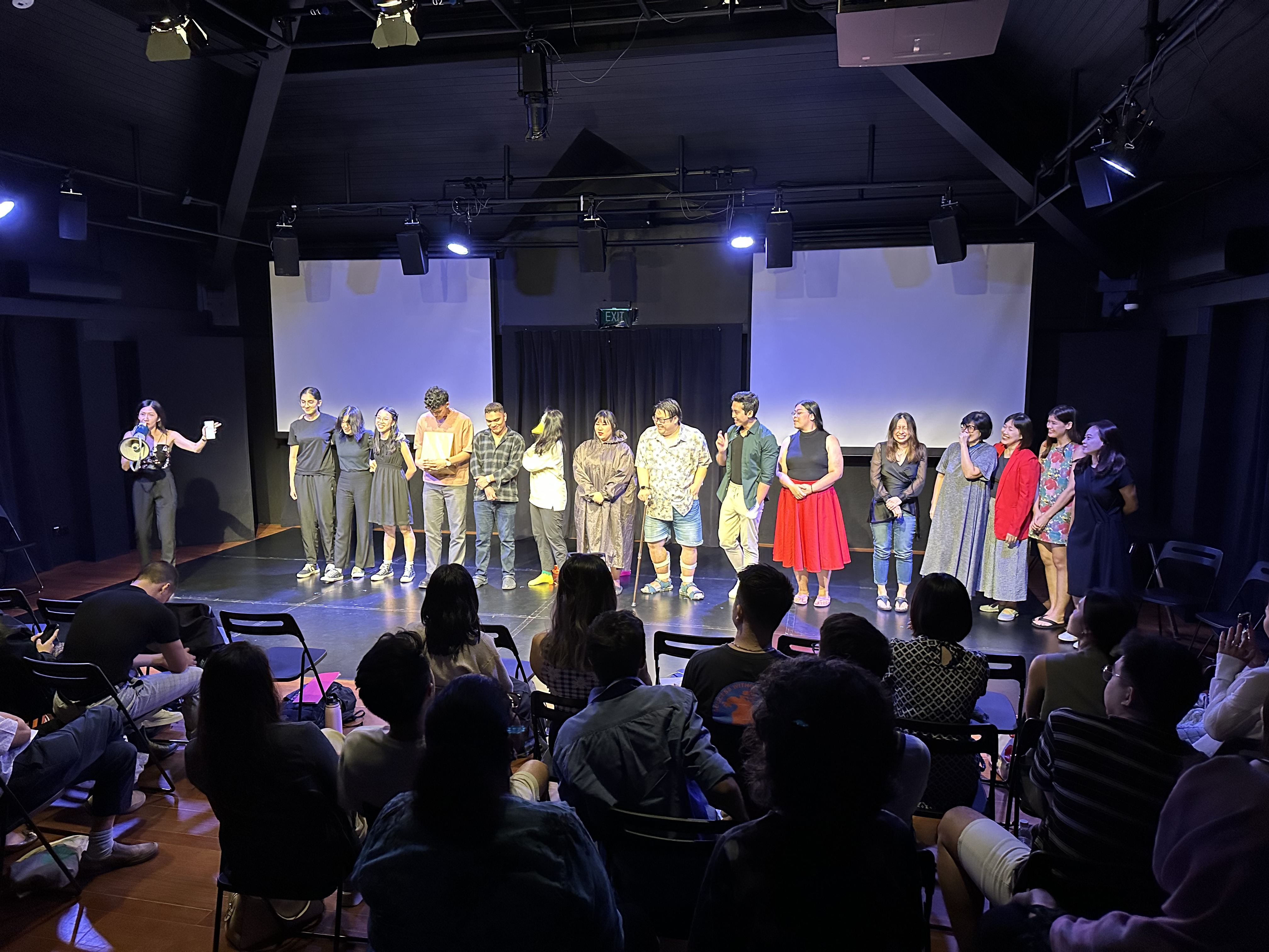 A photograph at curtain call for Headline Acts 1, with the cast and playwrights.