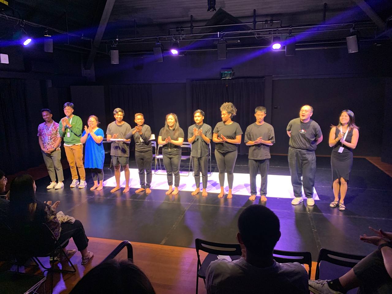 A photograph at curtain call for Studio A, with the cast and playwrights.