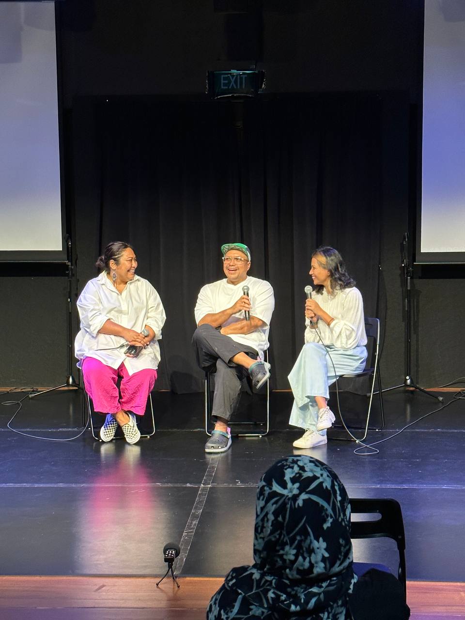 A photograph of Fezhah Maznan, Writer-in-Residence Zulfadli Rashid and Nabilah Said, seated on stage in conversation with one another.