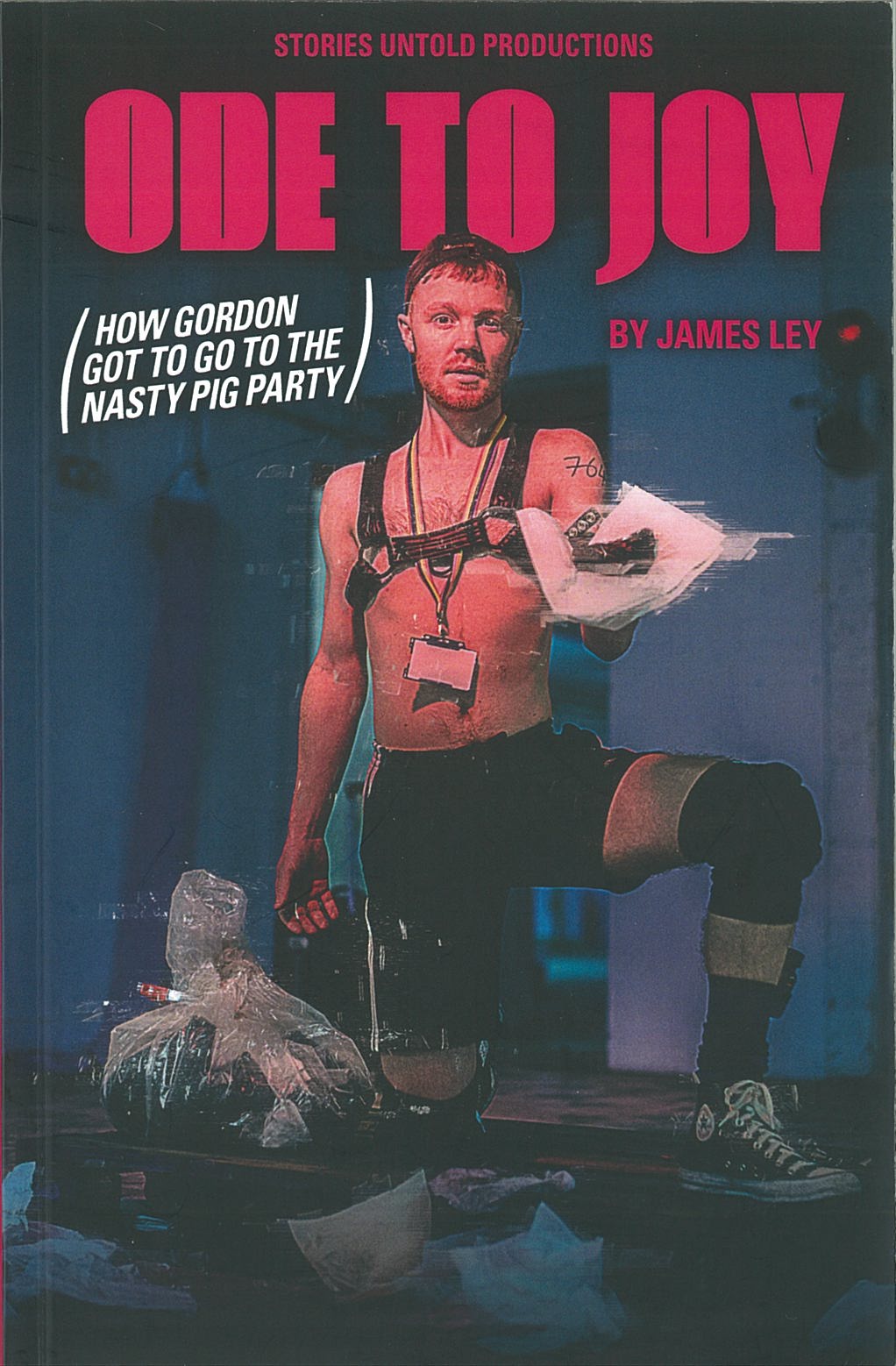 The publication features a male presenting person wearing a revealing outfit in a dimly lit room. The title "Ode to Joy" is printed above in pink font.